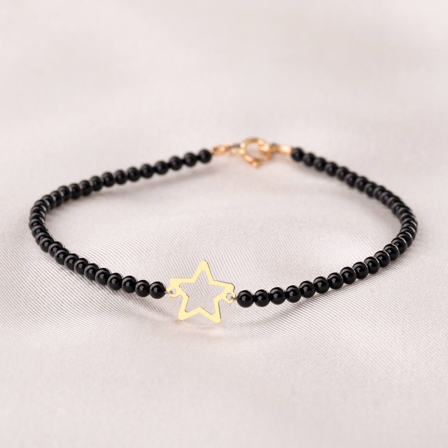 Black onyx online gold bracelet